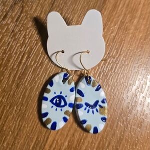 Whimsical Gold and Blue Winking Clay Earrings
